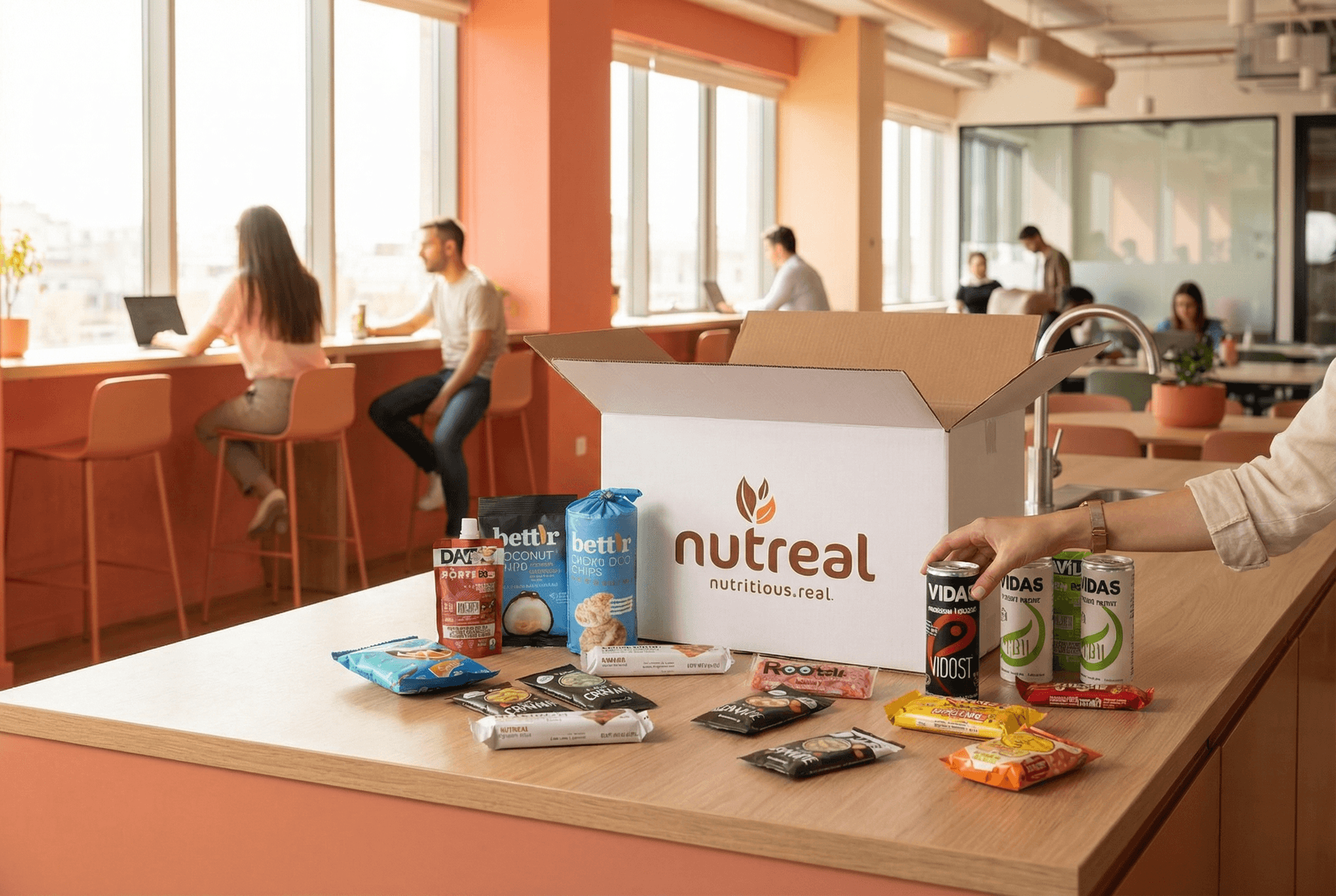 Nutreal snack box in a modern office kitchen with team members